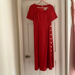 Red dress. Has buttons on the side.